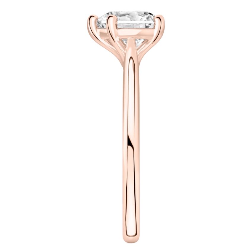 Side view of heart shape diamond cathedral solitaire engagement ring rose gold