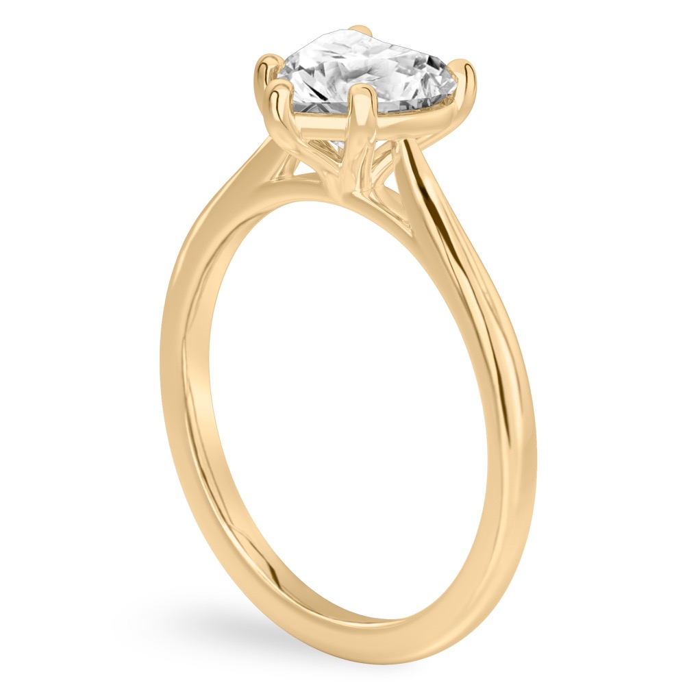 Angle view of heart shape diamond cathedral solitaire engagement ring yellow gold