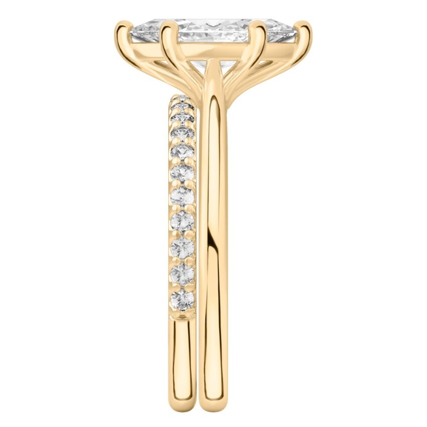Side view of marquise cut diamond cathedral solitaire engagement ring set yellow gold