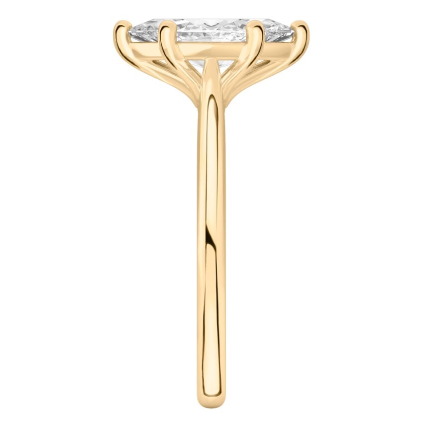Side view of marquise cut diamond cathedral solitaire engagement ring yellow gold