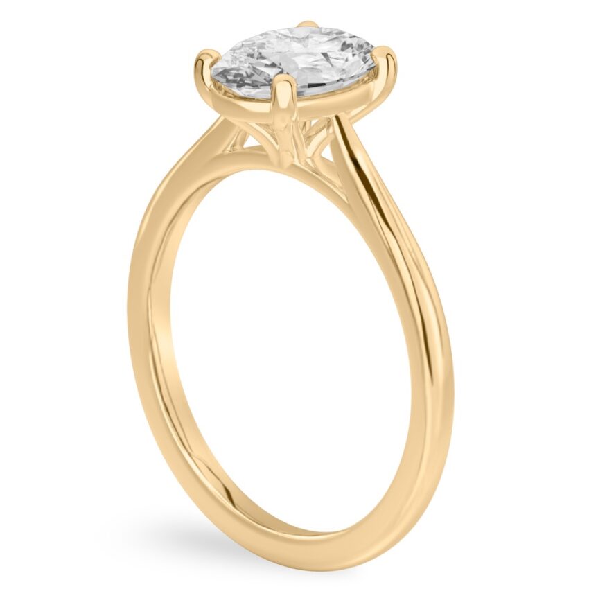 Angle view of oval shape diamond cathedral solitaire engagement ring yellow gold