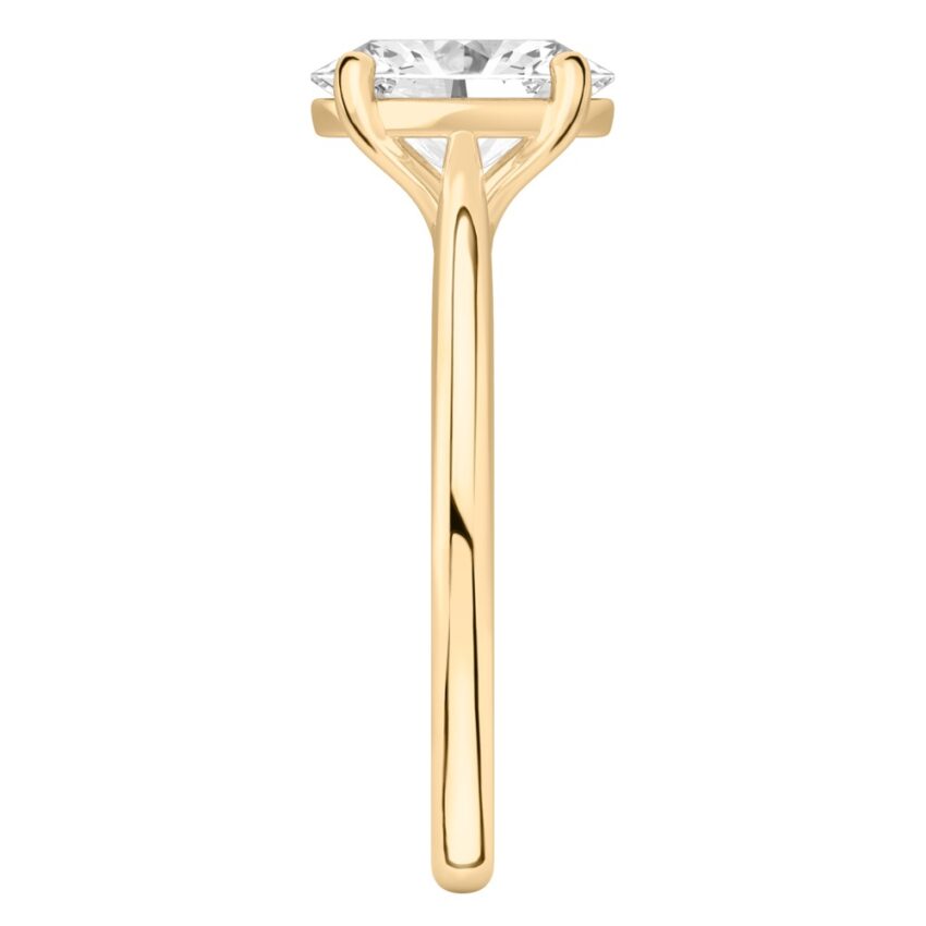 Side view of oval shape diamond cathedral solitaire engagement ring yellow gold