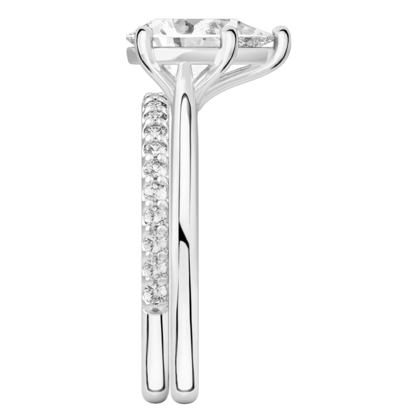 Side view of pear shape diamond cathedral solitaire engagement ring set white gold