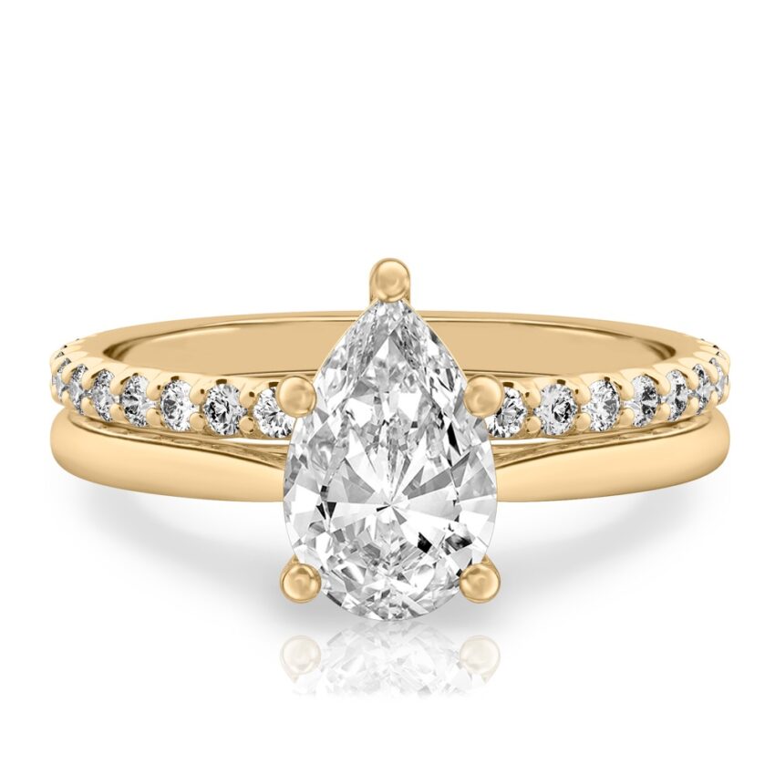 pear shape diamond cathedral solitaire engagement ring set in yellow gold