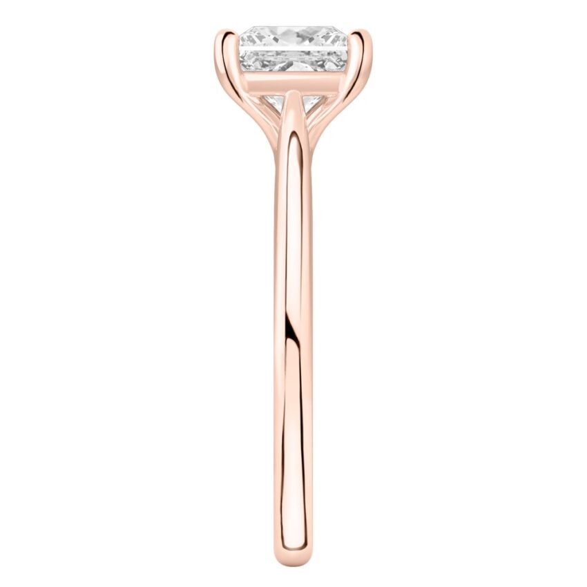 Side view of princess cut diamond cathedral solitaire engagement ring rose gold
