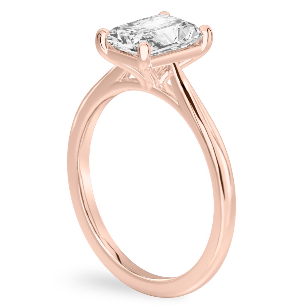 Angle view of radiant cut diamond cathedral solitaire engagement ring rose gold