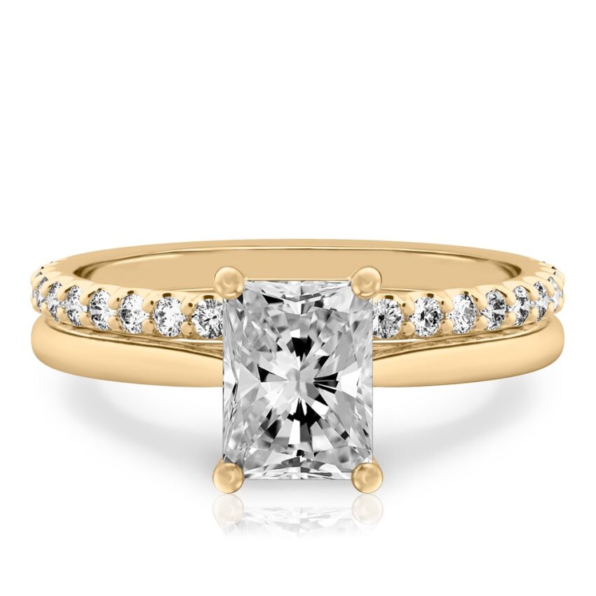 radiant cut diamond cathedral solitaire engagement ring set in yellow gold