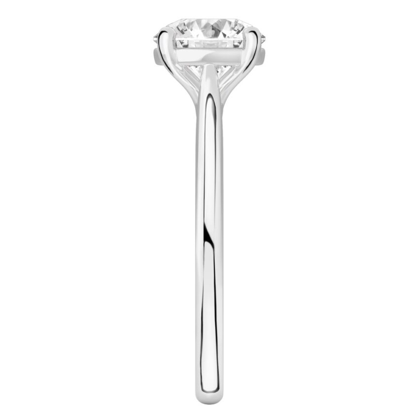 Side view of round cut diamond cathedral solitaire engagement ring platinum