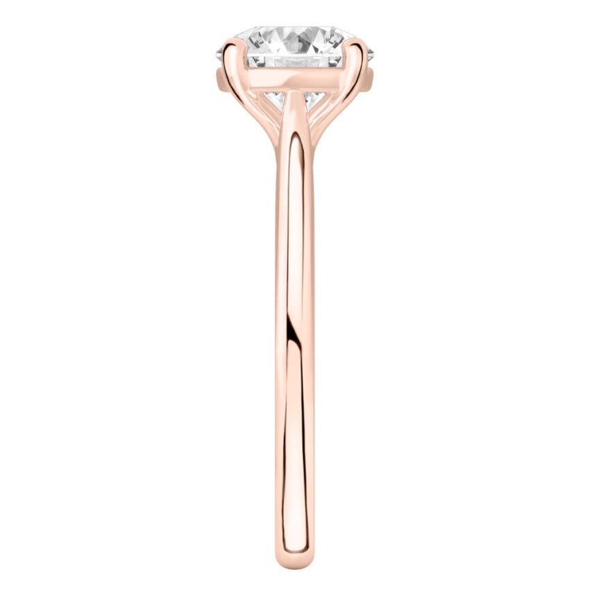 Side view of round cut diamond cathedral solitaire engagement ring rose gold