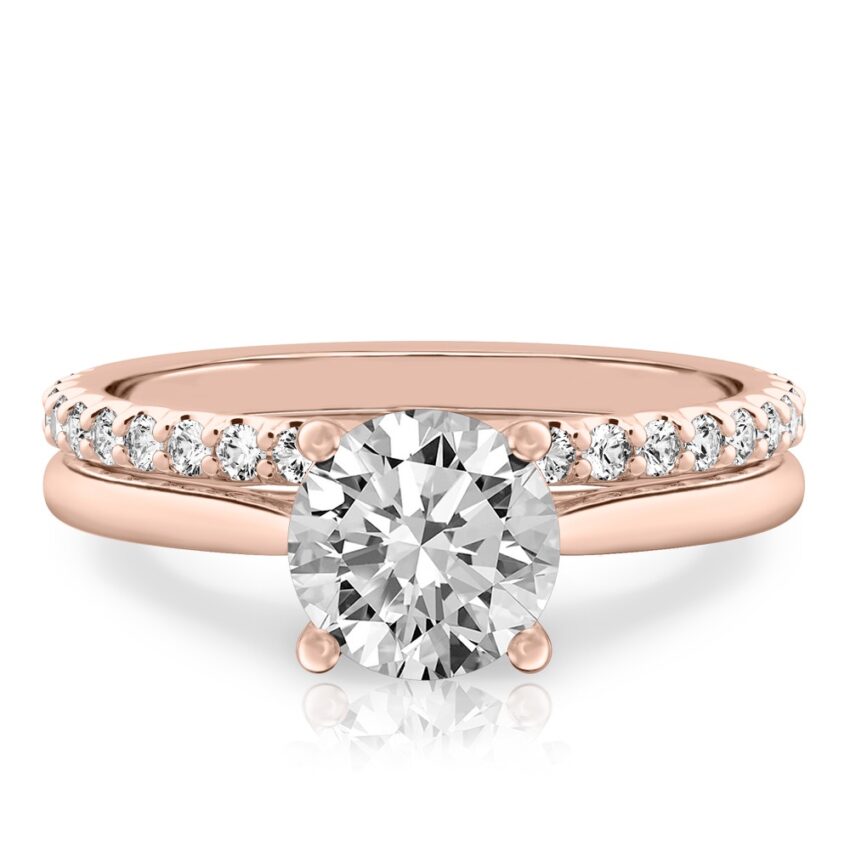 round cut diamond cathedral solitaire engagement ring set in rose gold