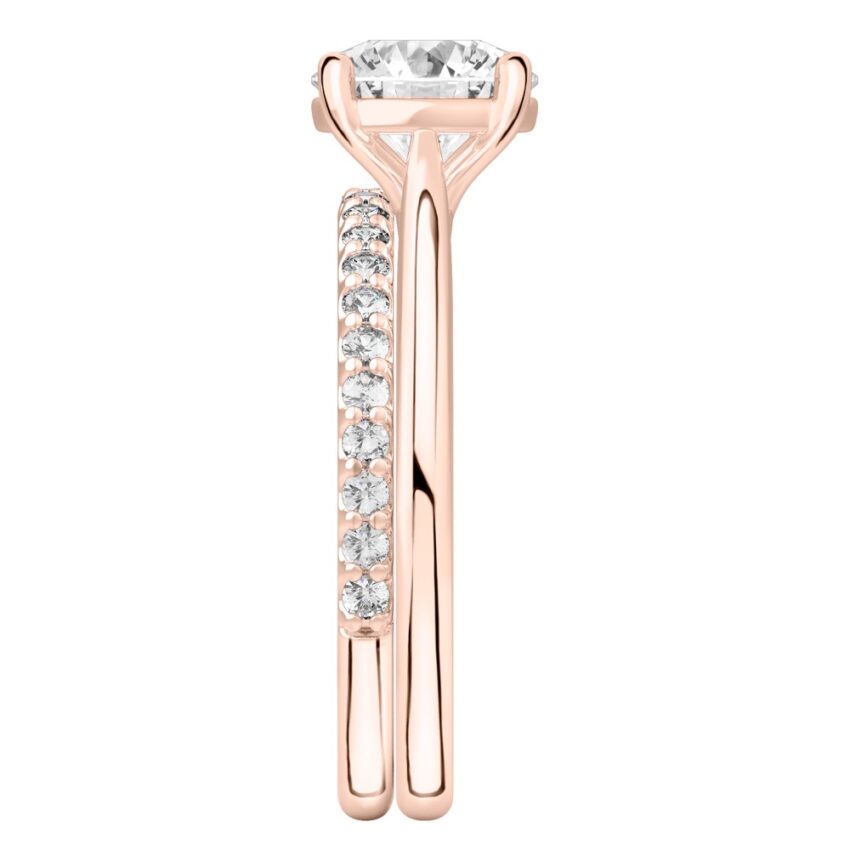 Side view of round cut diamond cathedral solitaire engagement ring set rose gold