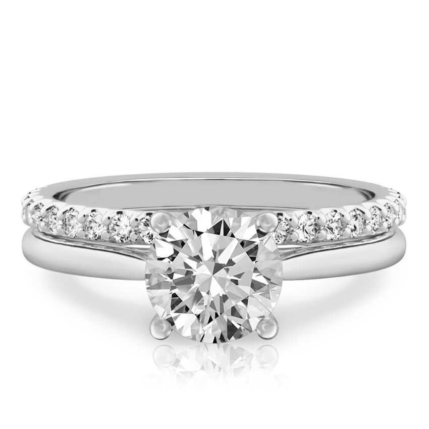 round cut diamond cathedral solitaire engagement ring set in white gold