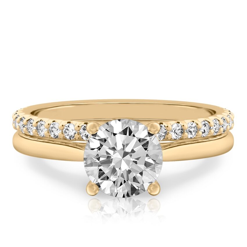 round cut diamond cathedral solitaire engagement ring set in yellow gold