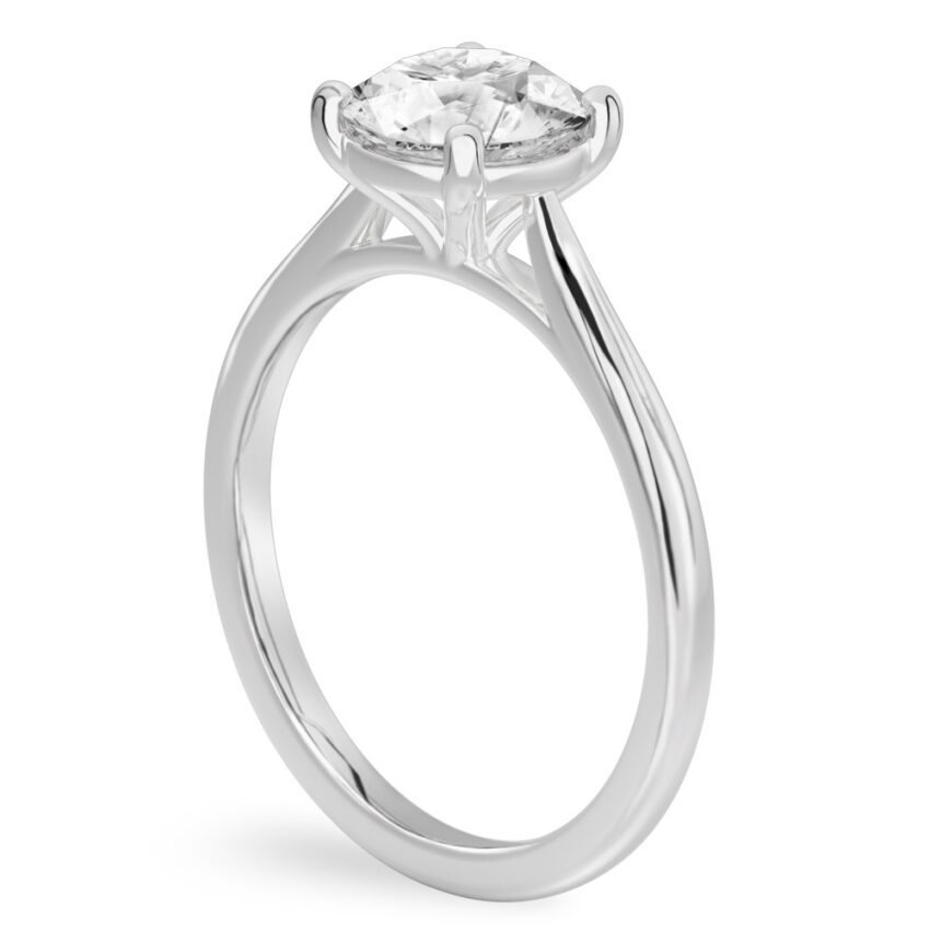 Angle view of round cut diamond cathedral solitaire engagement ring white gold