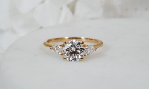 Round Diamond in Yellow Three Stone Ring