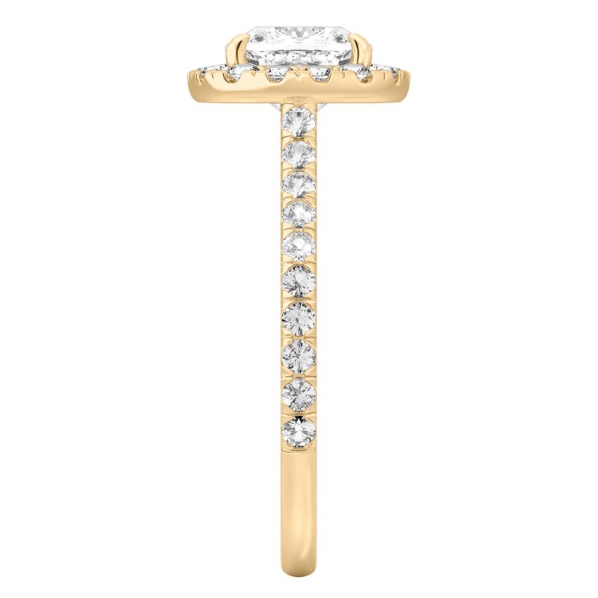 Side view of cushion cut diamond cushion halo engagement ring yellow gold