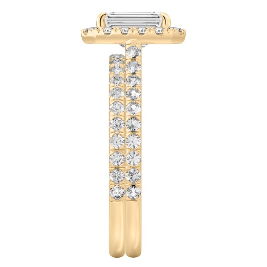 Side view of emerald cut diamond cushion halo engagement ring set yellow gold