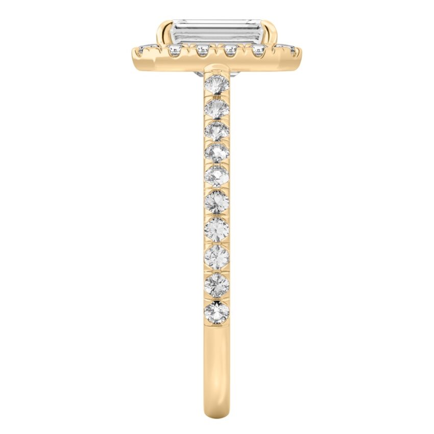 Side view of emerald cut diamond cushion halo engagement ring yellow gold