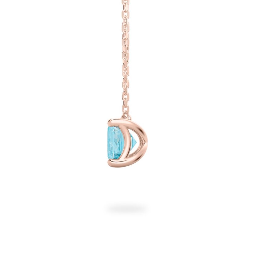 side view of emerald cut march birthstone necklace in rose gold
