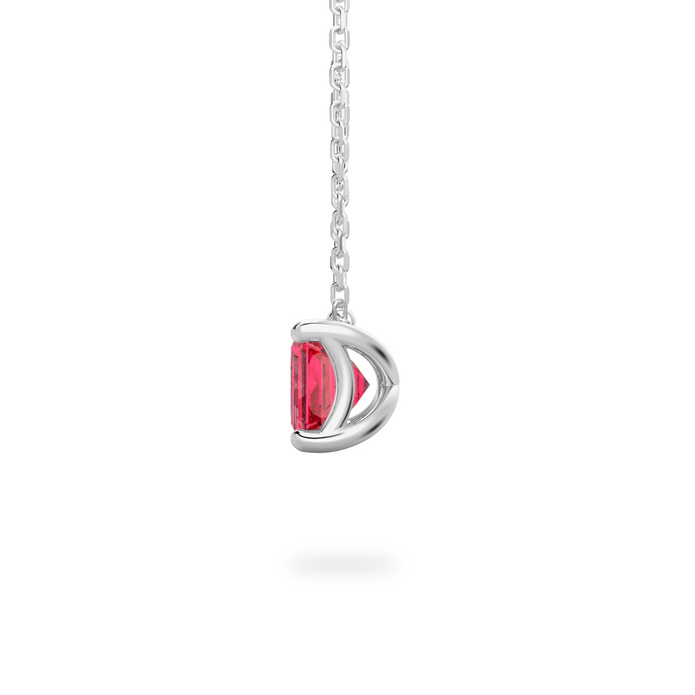 side view of emerald cut ruby necklace in white gold