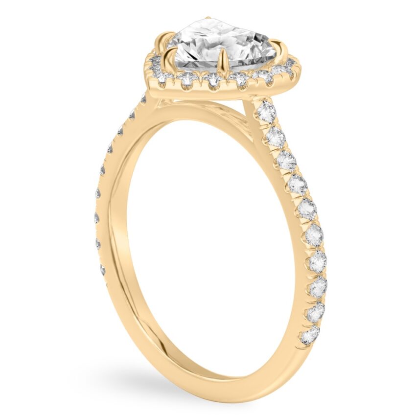 Angle view of heart shape diamond cushion halo engagement ring yellow gold