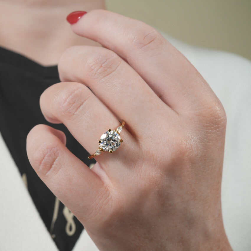 marquise and round cluster engagement ring in lifestyle