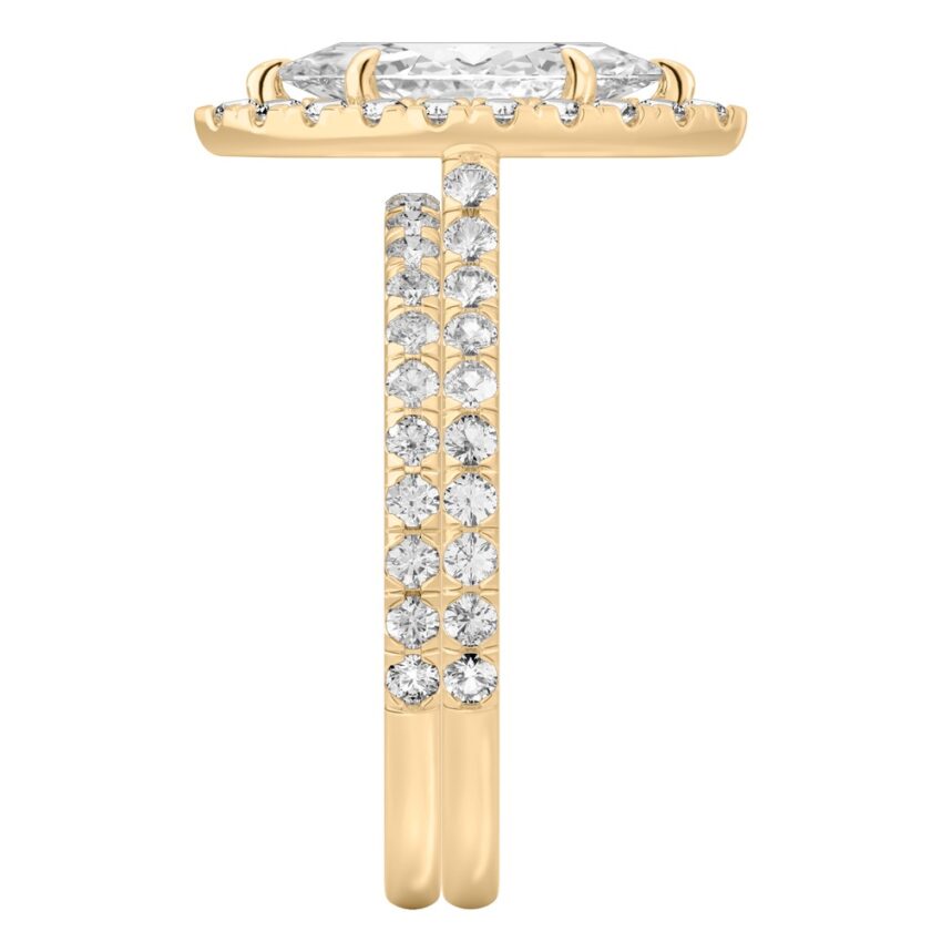 Side view of marquise cut diamond cushion halo engagement ring set yellow gold