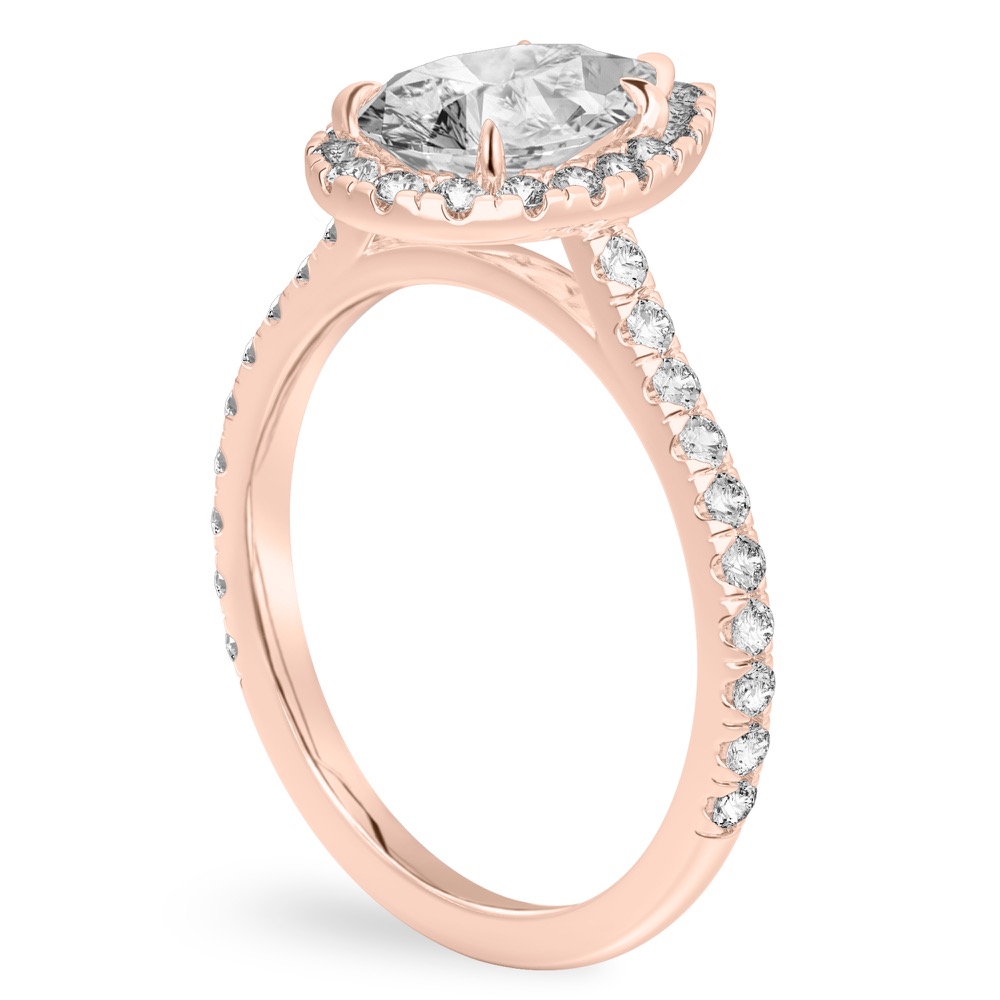 Angle view of pear shape diamond cushion halo engagement ring rose gold