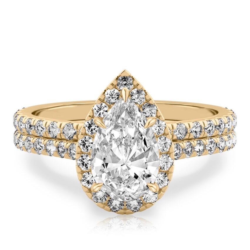 pear shape diamond cushion halo engagement ring set in yellow gold