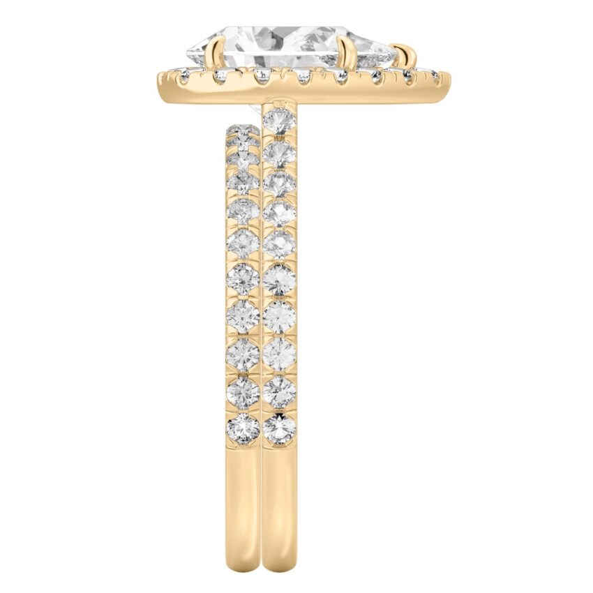 Side view of pear shape diamond cushion halo engagement ring set yellow gold