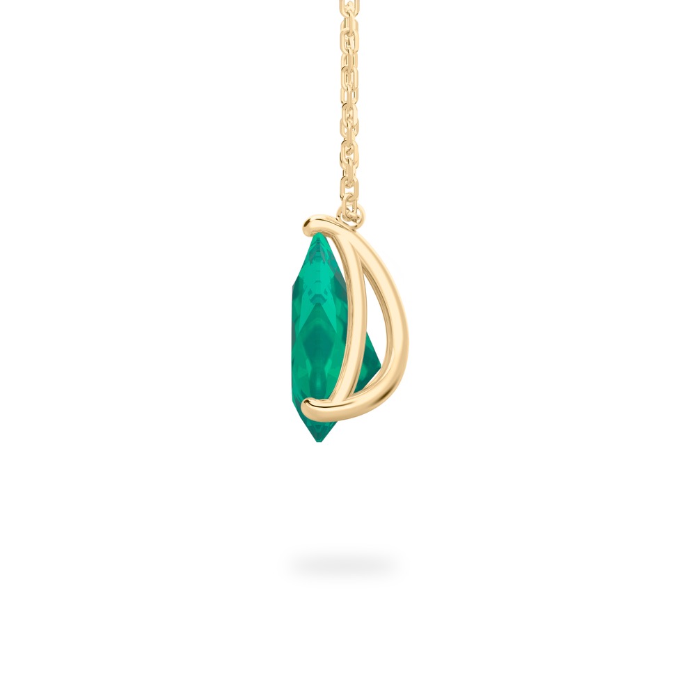 side view of pear shape emerald necklace in yellow gold