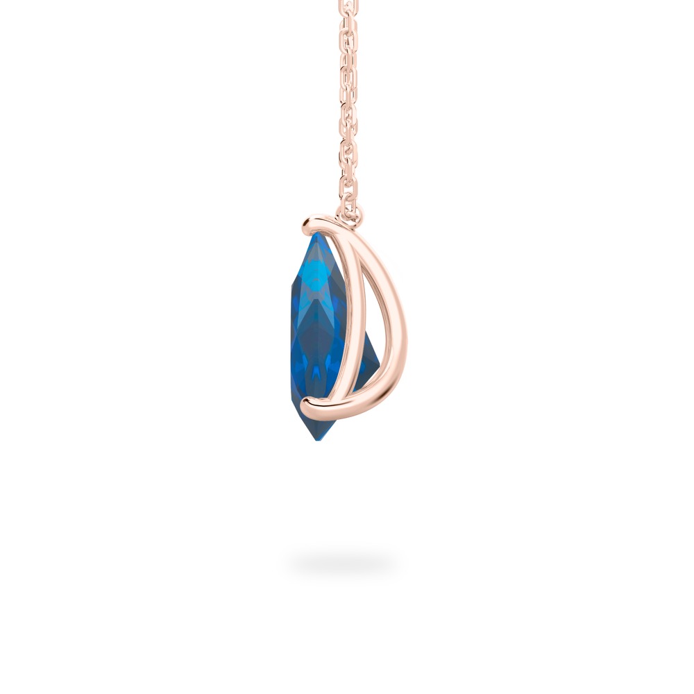 side view of pear shape sapphire necklace in rose gold