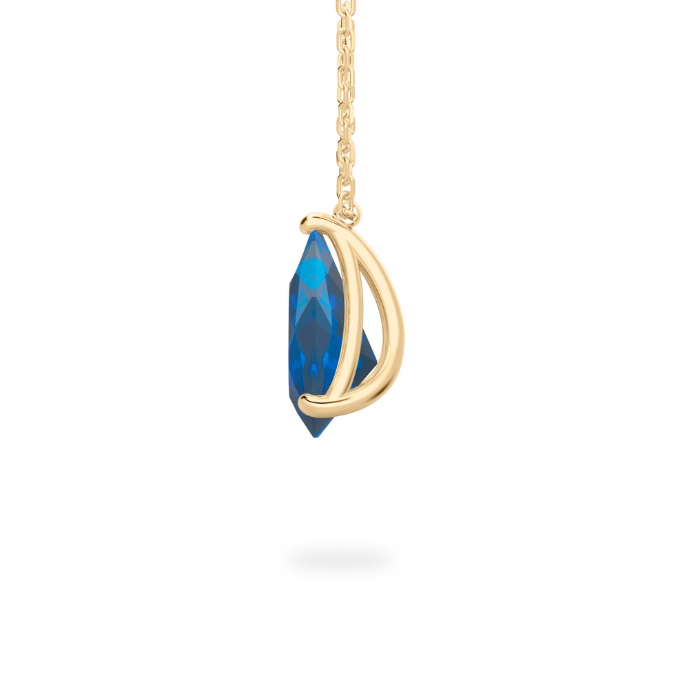 side view of pear shape sapphire necklace in yellow gold