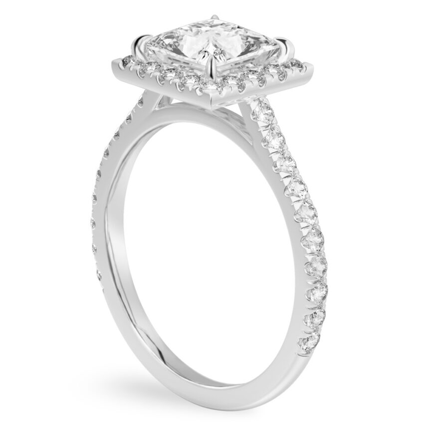Angle view of princess cut diamond cushion halo engagement ring platinum
