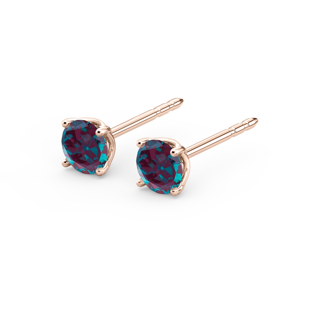 angle view of alexandrite earrings in rose gold with round cut gemstone