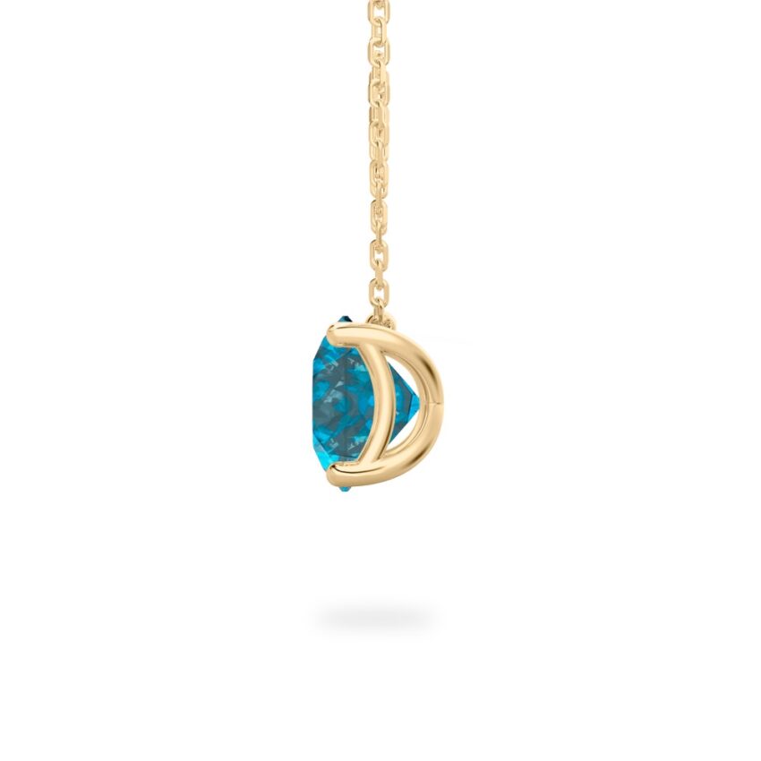 side view of round cut december birthstone necklace in yellow gold