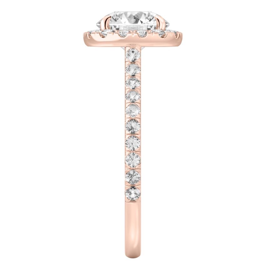 Side view of round cut diamond cushion halo engagement ring rose gold