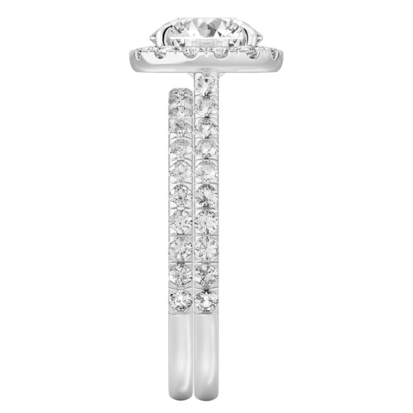 Side view of round cut diamond cushion halo engagement ring set white gold