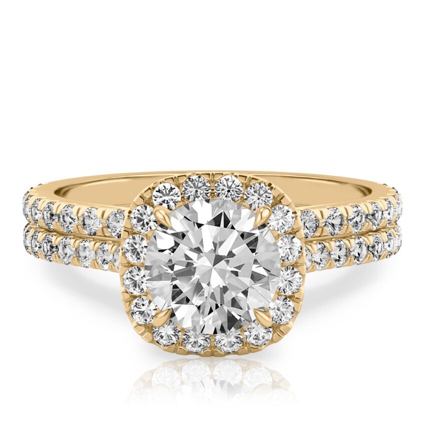 round cut diamond cushion halo engagement ring set in yellow gold