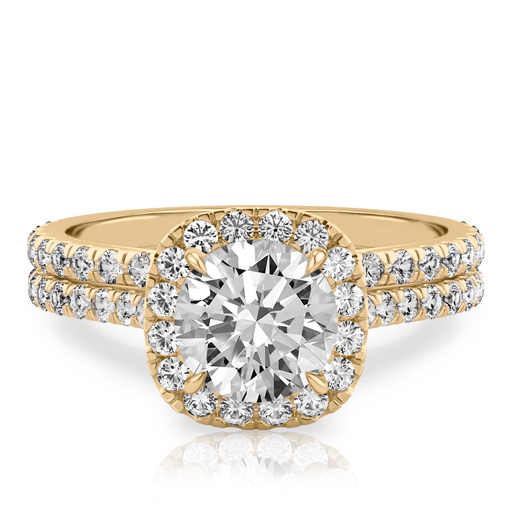 round cut diamond cushion halo engagement ring set in yellow gold
