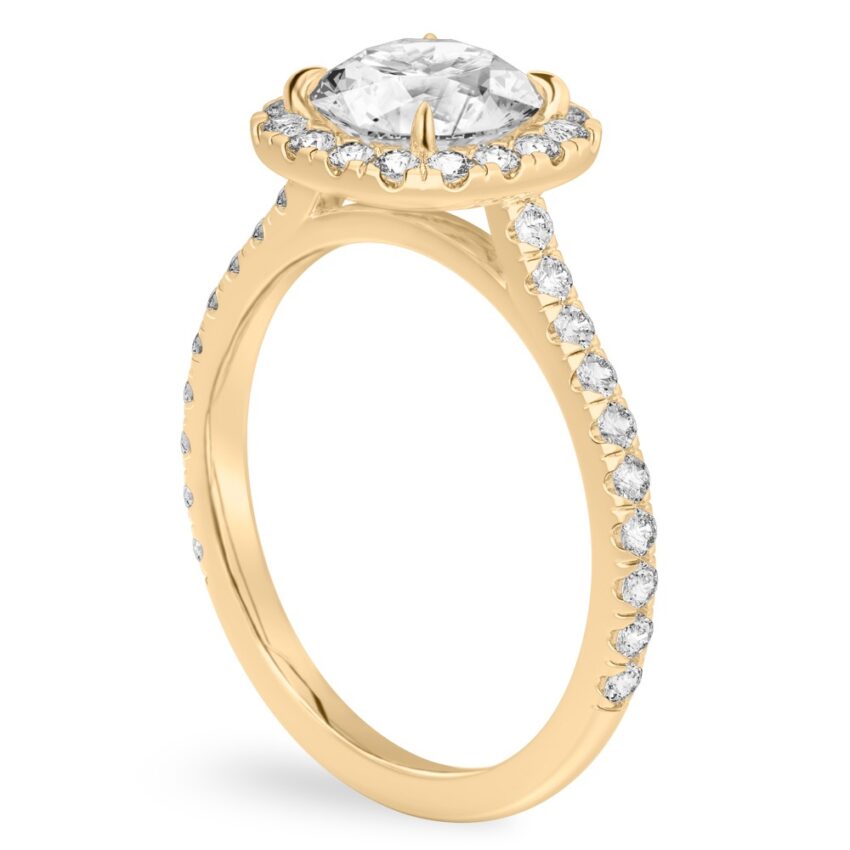 Angle view of round cut diamond cushion halo engagement ring yellow gold