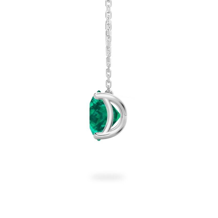 side view of round cut emerald necklace in white gold