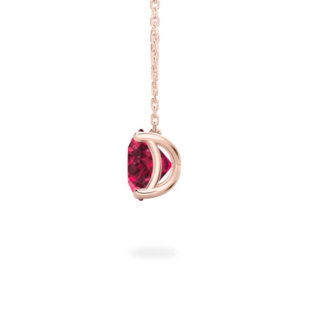 side view of round cut garnet necklace in rose gold