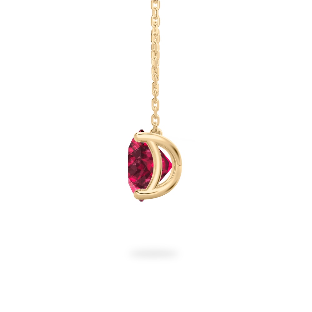 side view of round cut garnet necklace in yellow gold