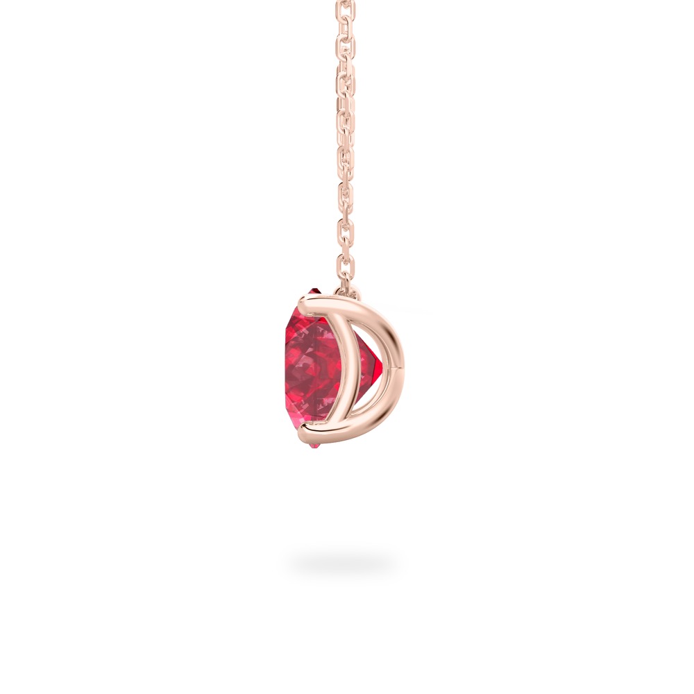 side view of round cut ruby necklace in rose gold