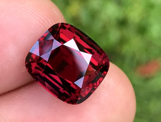 Garnet loose on fingertips