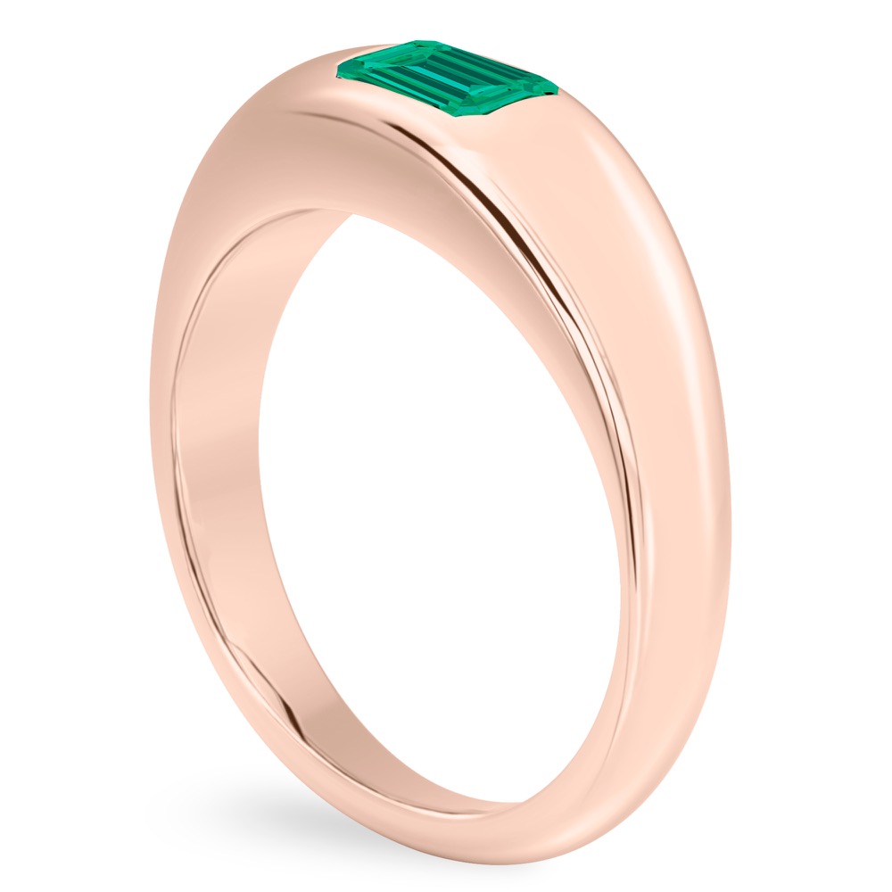 angle view of rose gold dome ring with east west set emerald cut emerald gemstone
