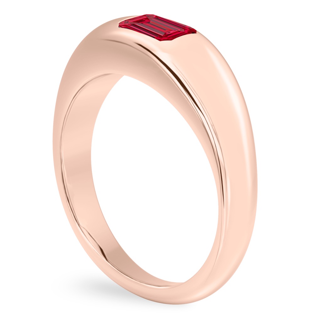 angle view of rose gold dome ring with east west set emerald ruby gemstone