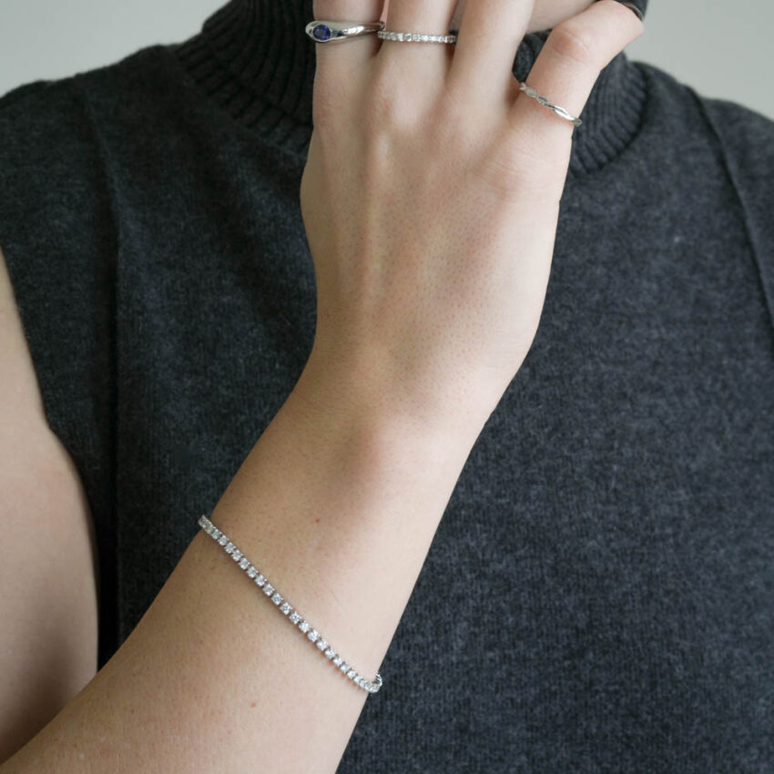 woman wearing tennis bracelet on wrist in 14k white gold