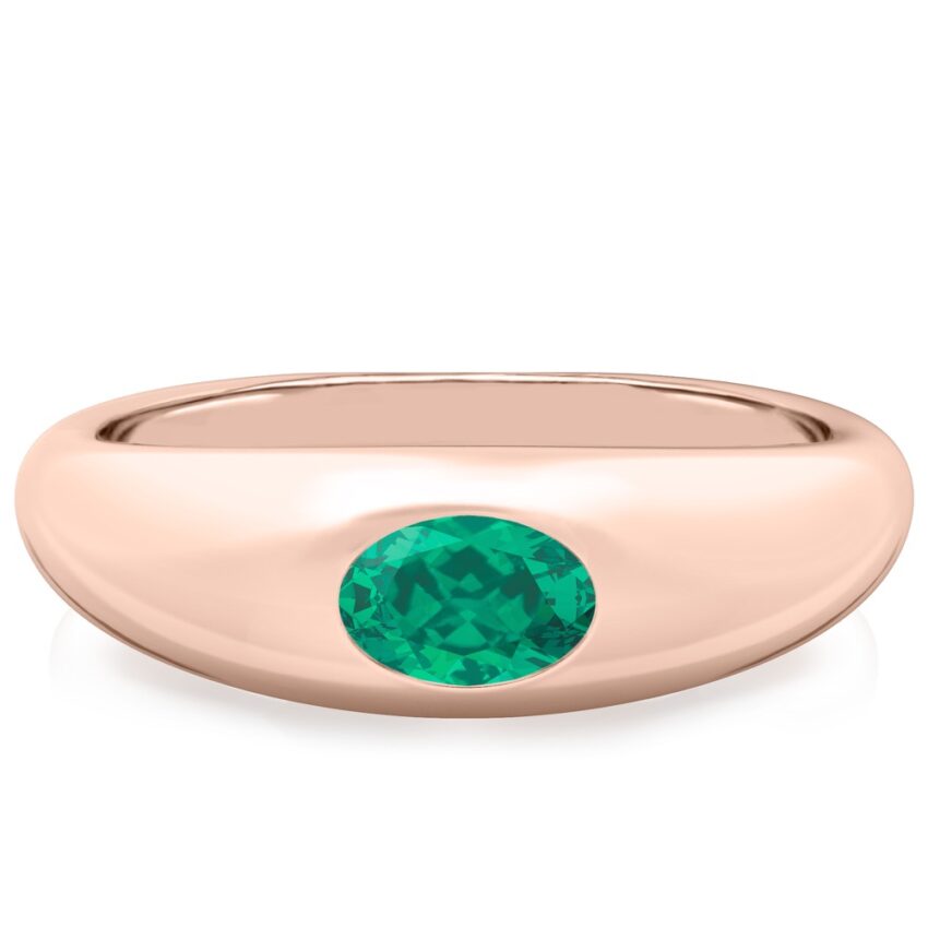 rose gold dome ring with east west set oval emerald gemstone